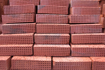 New red clay bricks for masonry building walls. Material for the construction of a new building.