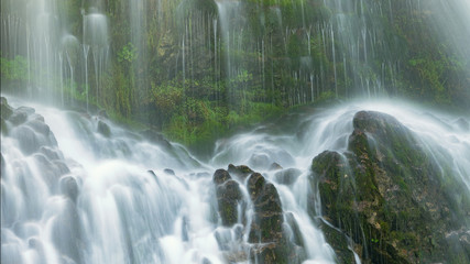 waterfall in the forest near bern, switzerland