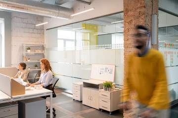 People working in modern open-space office