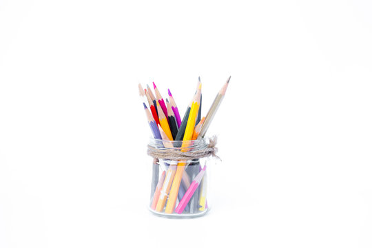 Pencils in glass bottles on white background,back to school background