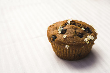 Fresh tasty blueberry muffin on a table