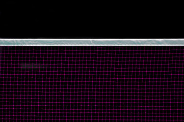 Badminton net indoor on badminton court, closeup view of badminton net with black background