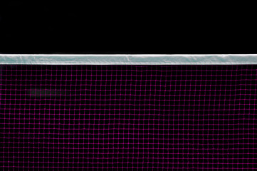 Badminton net indoor on badminton court, closeup view of badminton net with black background