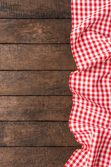 Gingham cloth on wooden table with copyspace