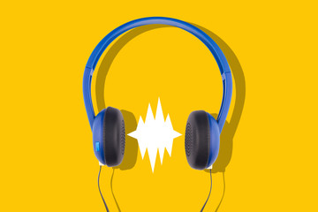 blue headphones isolated on yellow background