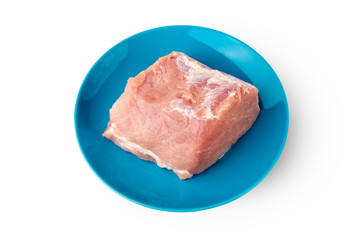 A piece of meat on a white background. Raw piece of pork on a plate close-up.