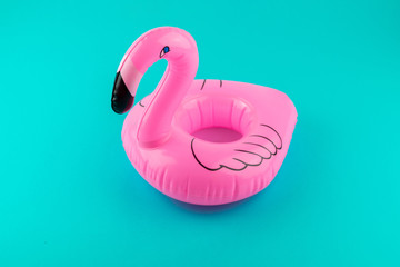 Pink, trendy, blown beach flamingo on a blue background. Hit the summer © Maksym