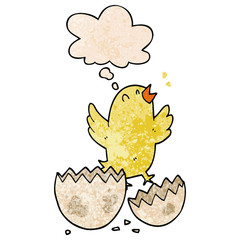 cartoon bird hatching from egg and thought bubble in grunge texture pattern style