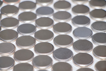 Batteries for the watch. Background, texture.