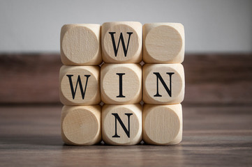 Cubes and dice with win win situation on wooden background