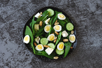 Keto diet. Salad with spinach, quail eggs and peanuts. Keto Salad Healthy diet.