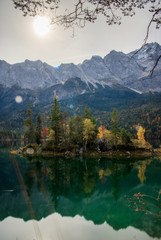 Naklejka premium Reflections of the alps in a mountain lake