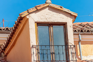 horizontal view of an ancient attic with tiles roof