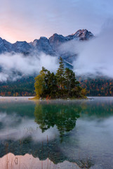 Reflections of the sunrise at the Eibsee