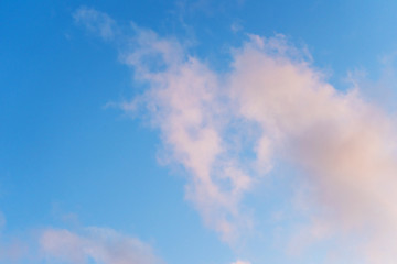 Blue sky with pink clouds