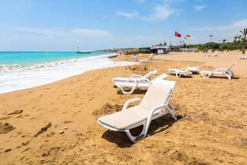 Fototapeta na wymiar Sun lounger on the beach on Turkish Riviera near Side