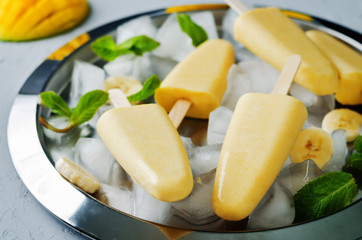 Banana mango ice cream with fruits and ices