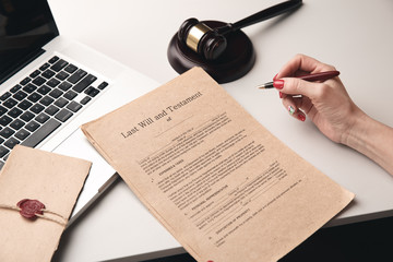 Paper documents with stamp on the desk. Notary concept, laptop work