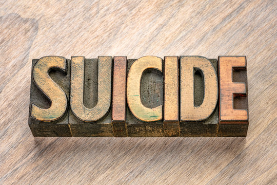 suicide word in letterpress wood type