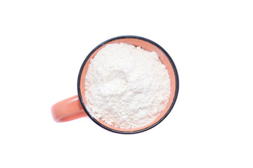 White wheat flour in an glass isolated on white background