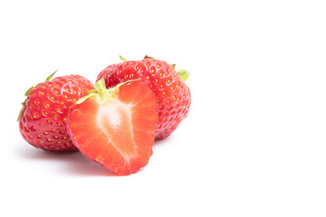 Isolated strawberries. Two whole strawberry fruits and half isolated on white background, with clipping path, copy space