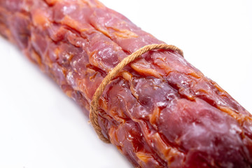 juicy and tasty smoked sausage isolated on white background