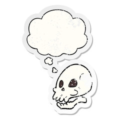 cartoon skull and thought bubble as a distressed worn sticker