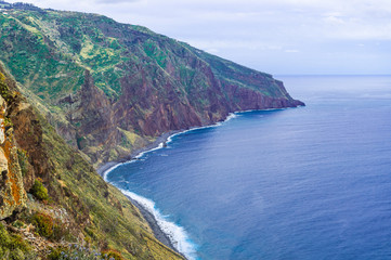 Fototapeta na wymiar Aerial Madeira island view with Atlantic ocean, white waves, cliffs and nature