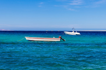 Fototapeta premium Small boats, pleasure boats, fish boats. Majestic day on the Egyptian Red Sea, Hurghada, Egypt
