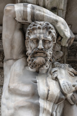 Stone sculpture of a strong man