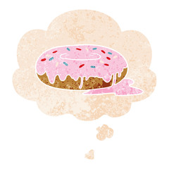cartoon donut and thought bubble in retro textured style