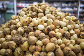 Fresh harvest onions. Onions background. Onions in market