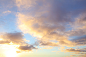 Naklejka na ściany i meble Sunlit clouds in sky