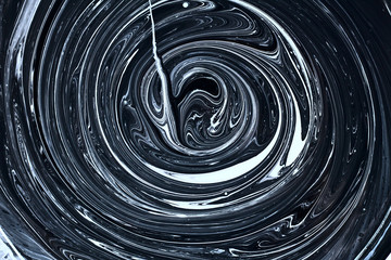 abstract image mixing of two colors. The texture of the circles of white and black paint