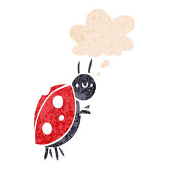 cartoon ladybug and thought bubble in retro textured style