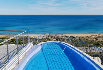 Poolside and view to the Mediterranean Sea. Spain