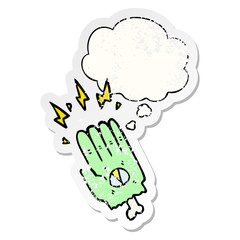 spooky halloween zombie hand and thought bubble as a distressed worn sticker