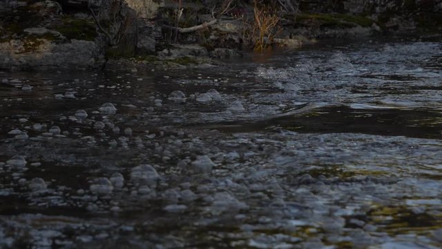 Pomps on top of a river in slow motion.