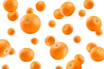 Falling mandarin, tangerine, isolated on white background, selective focus