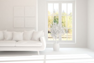 Stylish room in white color with sofa and autumn landscape in window. Scandinavian interior design. 3D illustration