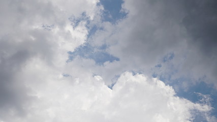 in the sky, the sun's rays pass through the clouds