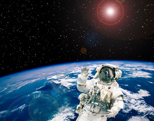 Obraz premium Fascinating earth and astronaut flying in outer space. The elements of this image furnished by NASA.