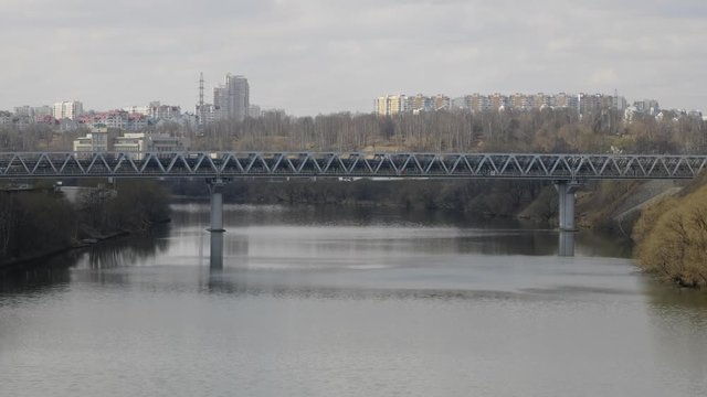 Modern high-speed train "Lastochka" (Swallow) on the Andreevsky Bridge.