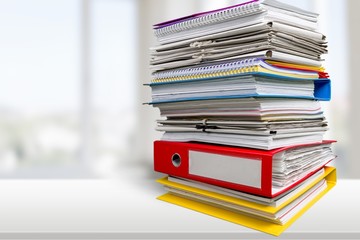 File folders with documents on white table