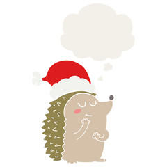 cartoon hedgehog wearing christmas hat and thought bubble in retro style