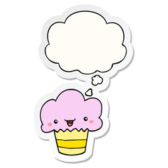 cartoon cupcake with face and thought bubble as a printed sticker