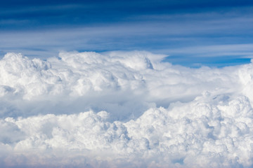 Naklejka premium The blue sky and white clouds during a flight