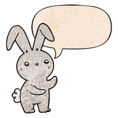 cute cartoon rabbit and speech bubble in retro texture style