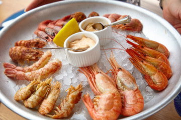 Different shrimp( nerd, bear and others), ice on ice with sauce.