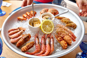 Different shrimp( nerd, bear and others), ice on ice with sauce.